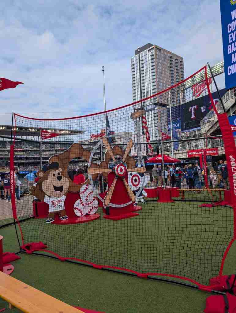 T.C. Bear and Bullseye target cutouts in a throwing net at Target Field
