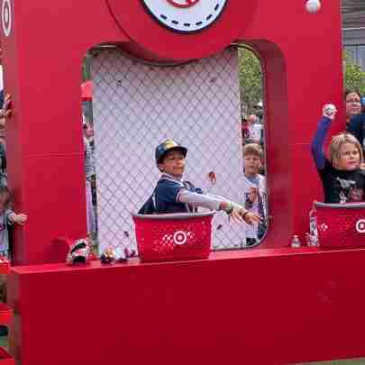 Boy throws a baseball at a Target Field Kids Day game