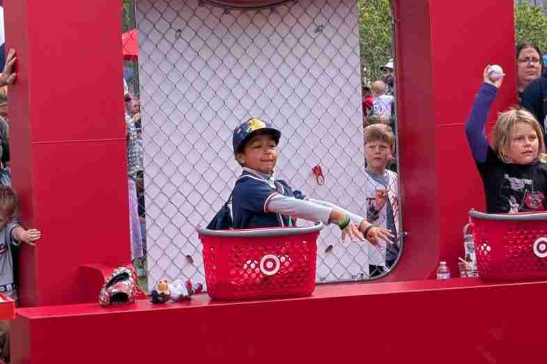 Boy throws a baseball at a Target Field Kids Day game