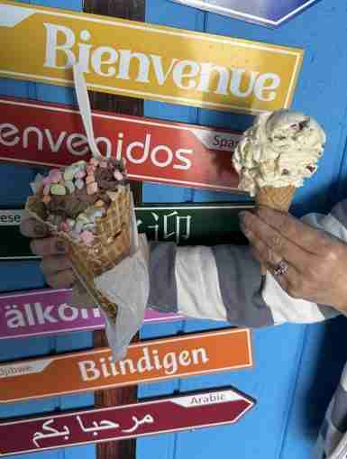 Big River Scoop waffle cone with rainbow marshmallows and a Praline Pecan gluten-free sugar cone
