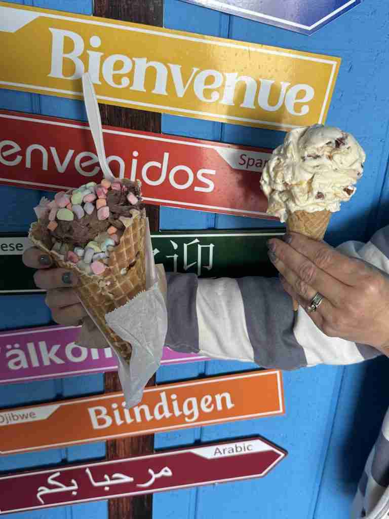 Big River Scoop waffle cone with rainbow marshmallows and a Praline Pecan gluten-free sugar cone